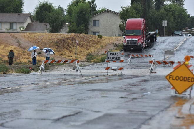 Several streets near Doris Davies Park, in Victorville, California, were closed off due to flooding on August 20, 2023. Hurricane Hilary weakened to a tropical storm but was still likely to bring flooding to the region.