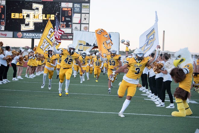 The Pueblo East Eagles take the field at Dutch Clark Stadium at the start of the 2023 Cannon Game.