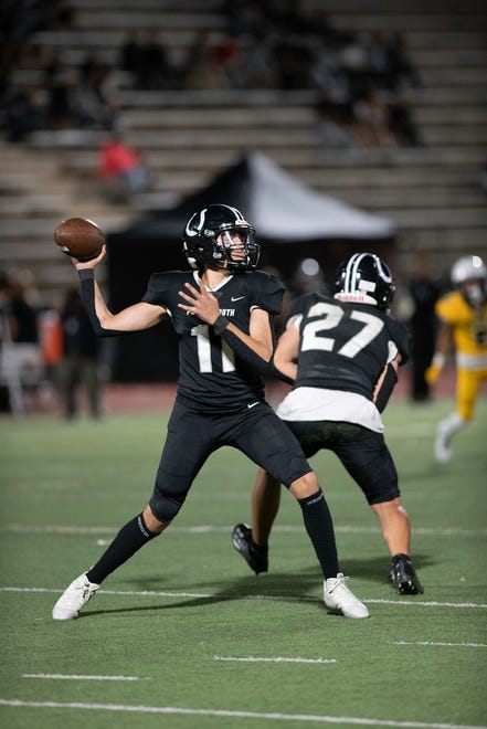 Pueblo South's Caeden Herrera pulls back to pass during the 2023 Cannon Game against Pueblo East at Dutch Clark Stadium on Friday, September 22, 2023.