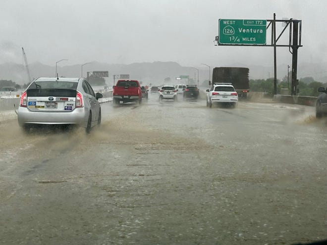 Flooding is seen on Interstate 5 near Valencia, California, where traffic was nearly at a standstill on Aug. 20, 2023.