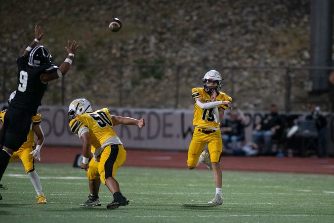 Pueblo East's Dolphka Lewis fires off a pass during the 2023 Cannon Game against Pueblo South at Dutch Clark Stadium.