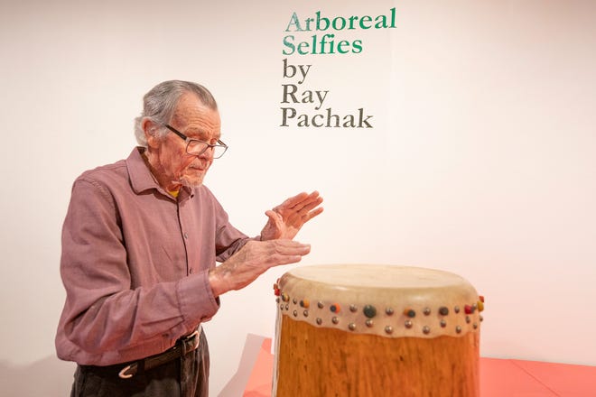 Local artist Ray Pachak beats on a drum he created that is part of his "Arboreal Selfies" exhibit that is one of the featured attractions for "The Weekend of Drumbeats" event at the Sangre de Cristo Arts and Conference Center.